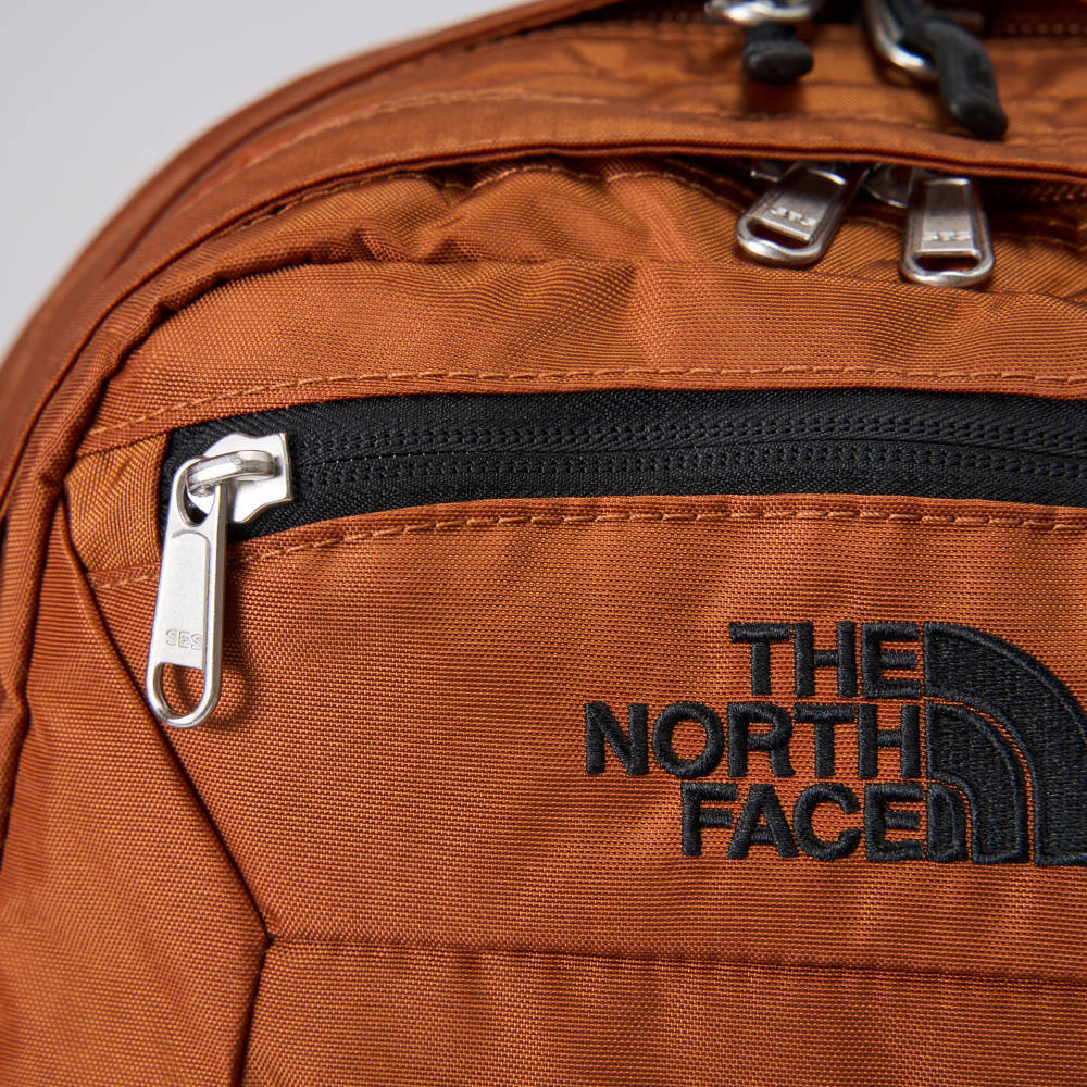 The North Face北面男女款橘色DWR防潑水休閒後背包｜CF9CC79